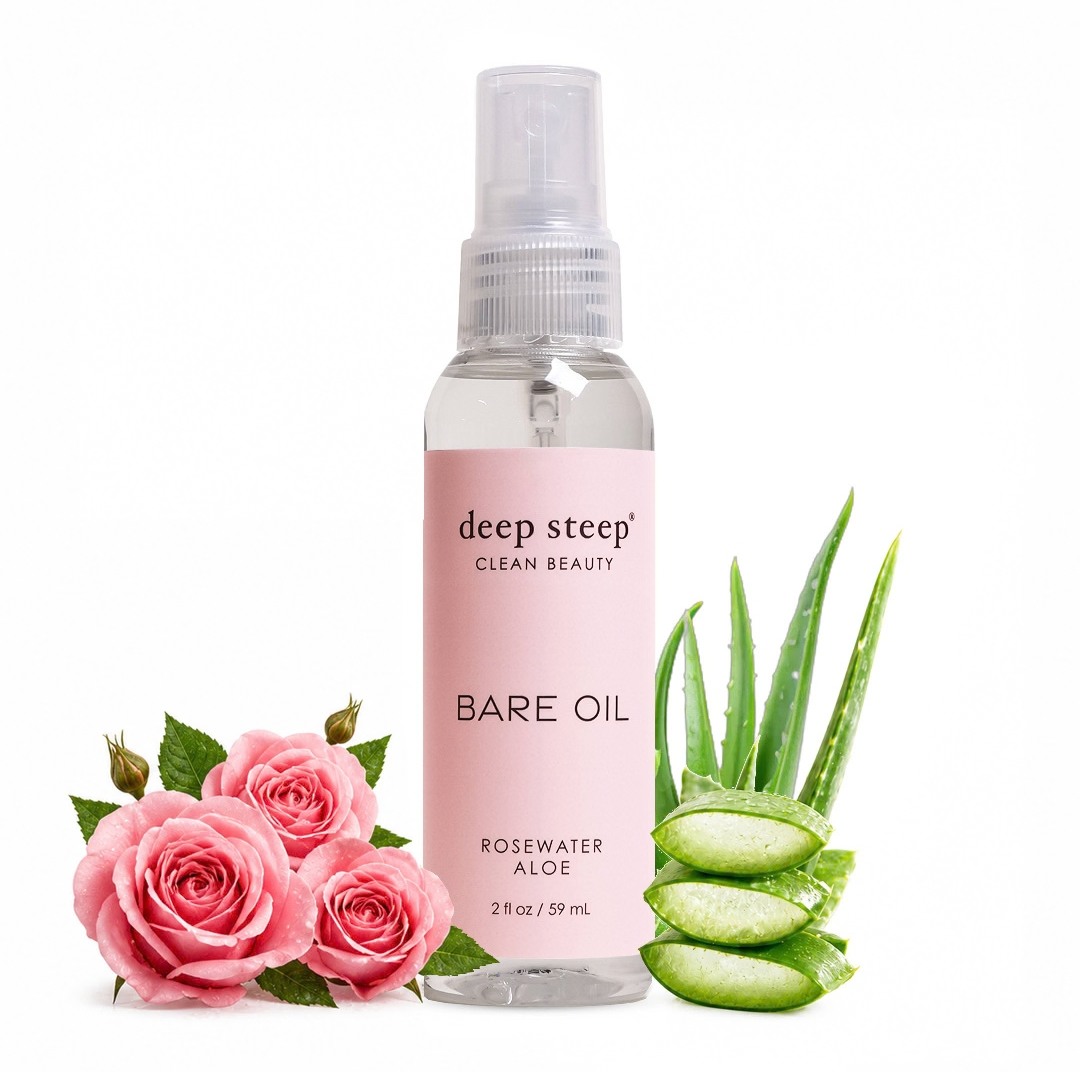 A 2 fl oz spray bottle of deep steep Clean Beauty Bare Oil Rosewater Aloe, flanked by pink roses and sliced aloe vera on a white background.