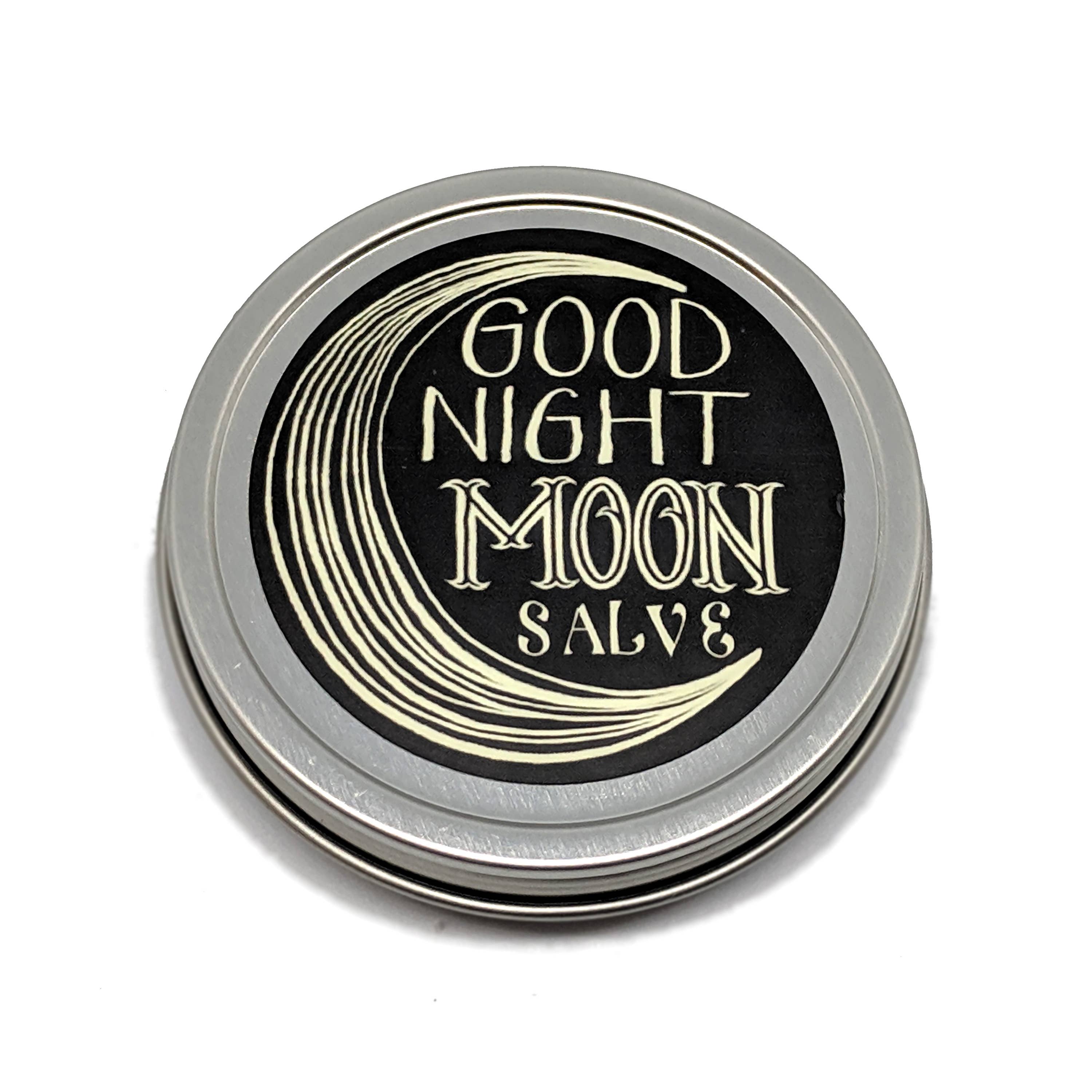 Tin of Good Night Moon Salve with black label and silver lid on white background