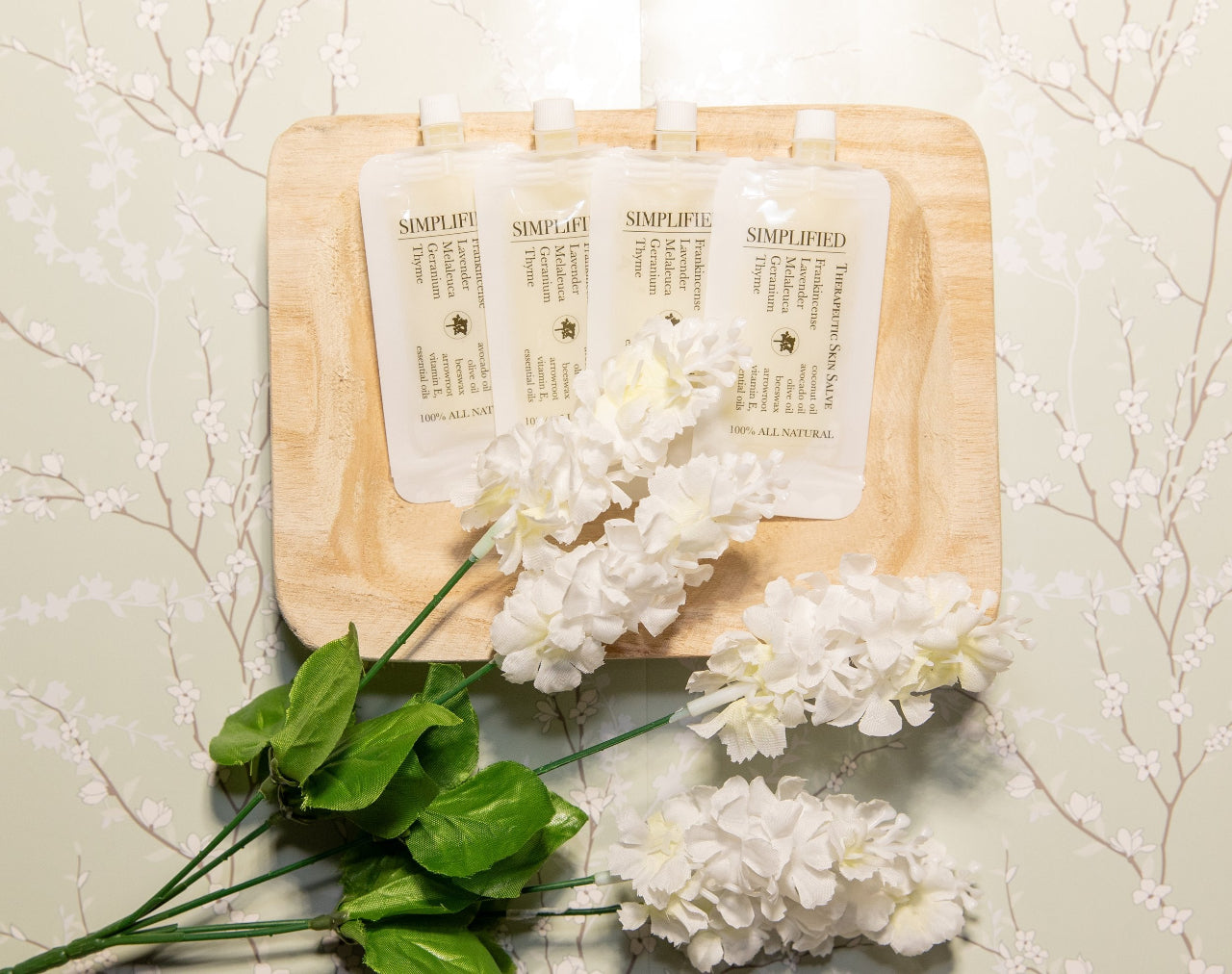 A pouch of 'Therapeutic Skin Salve' with a label that includes an list of ingredients and a definition of the product.