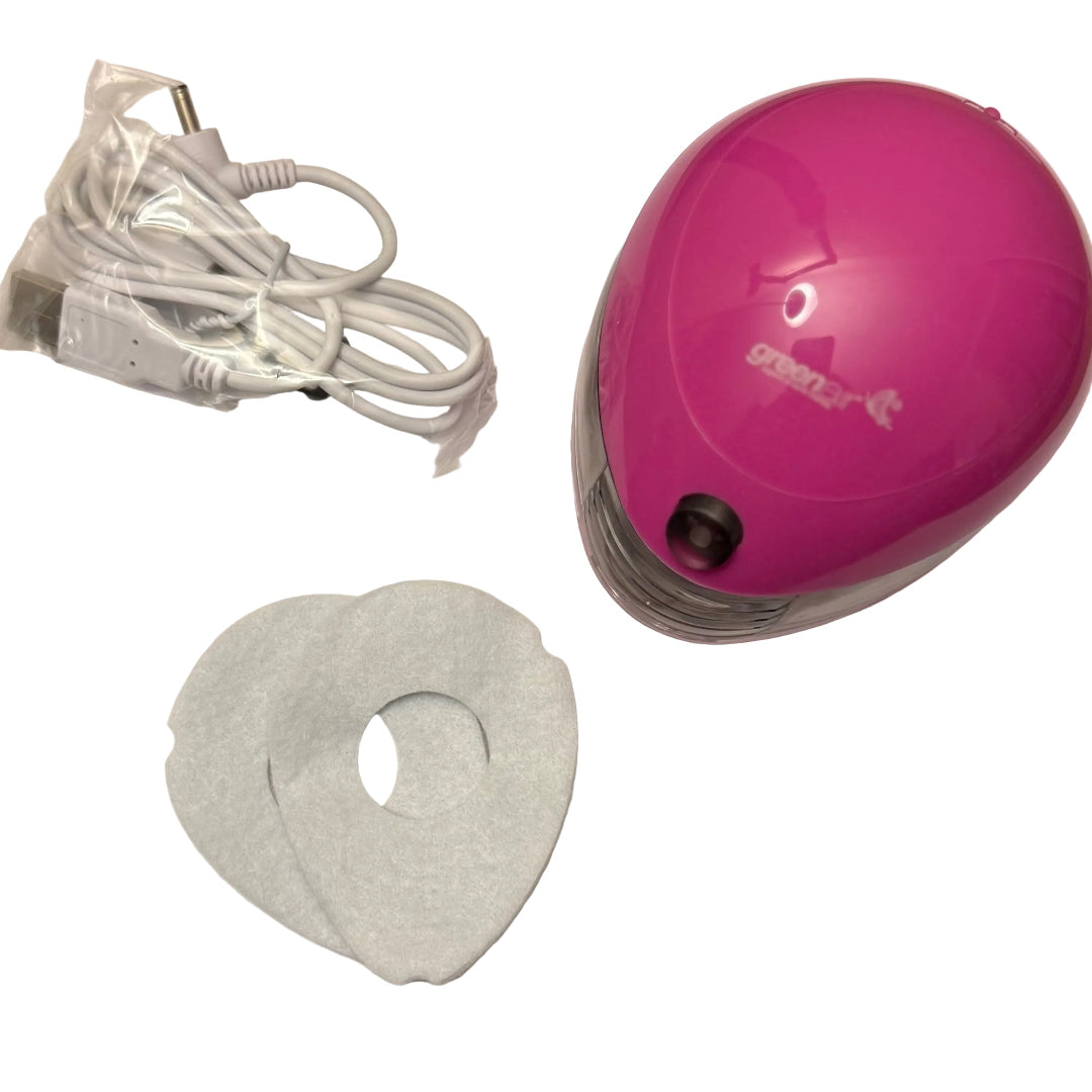 pink aroma pod diffuser with a cable and 2 replacement  pads on a white background